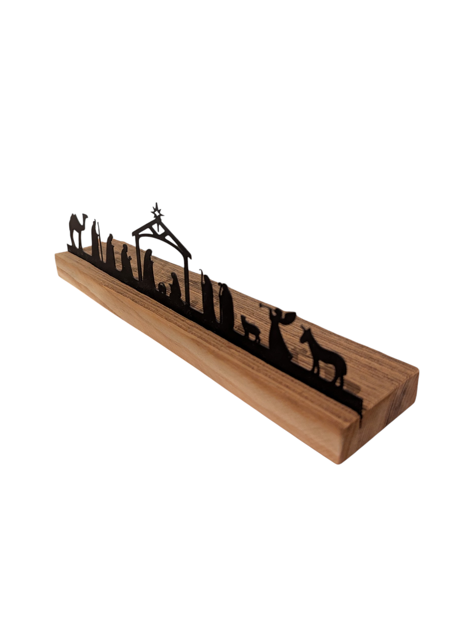 Weihnachtliche Krippeszene aus pulverlackiertem Metall in einem Sockel aus Altholz. 